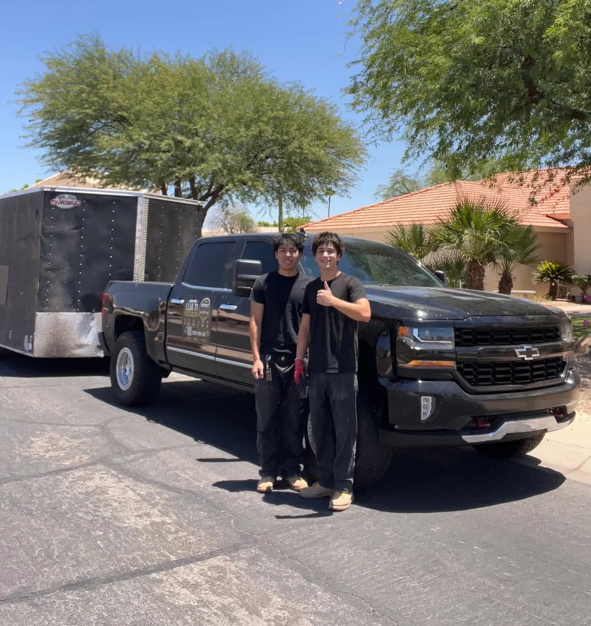 The two Canyon Haul Co. founders in front of their truck and trailer